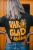 Ekologisk t shirt - glad i onödan svart med gul text